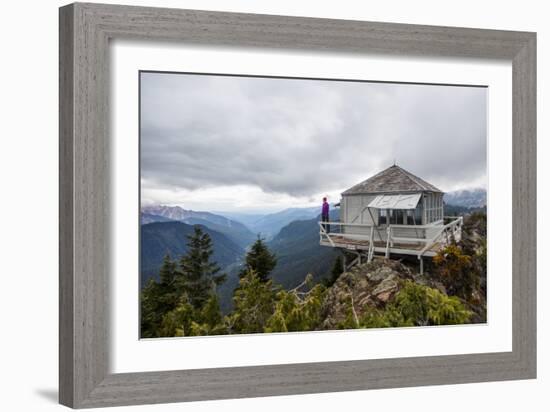 Woman Stands On The Edge Of A Backcountry Lookout Tower Overlooking The Cascade Mts Near Seattle-Michael Hanson-Framed Photographic Print