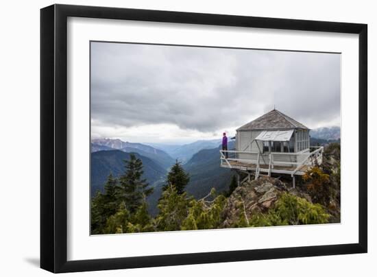 Woman Stands On The Edge Of A Backcountry Lookout Tower Overlooking The Cascade Mts Near Seattle-Michael Hanson-Framed Photographic Print