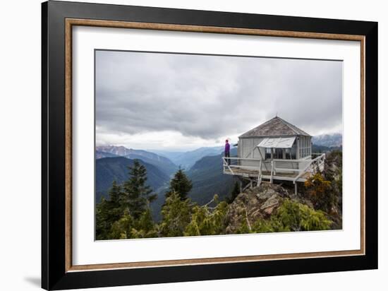 Woman Stands On The Edge Of A Backcountry Lookout Tower Overlooking The Cascade Mts Near Seattle-Michael Hanson-Framed Photographic Print