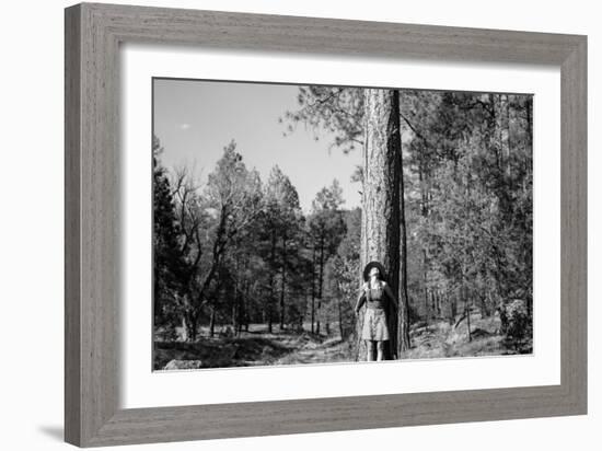 Woman Stands With Her Arms Wrapped Around A Ponderosa Pine Tree Looking Up And Smiling-Hannah Dewey-Framed Photographic Print