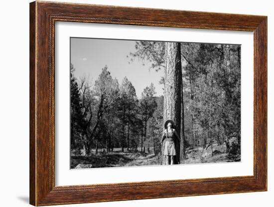 Woman Stands With Her Arms Wrapped Around A Ponderosa Pine Tree Looking Up And Smiling-Hannah Dewey-Framed Photographic Print