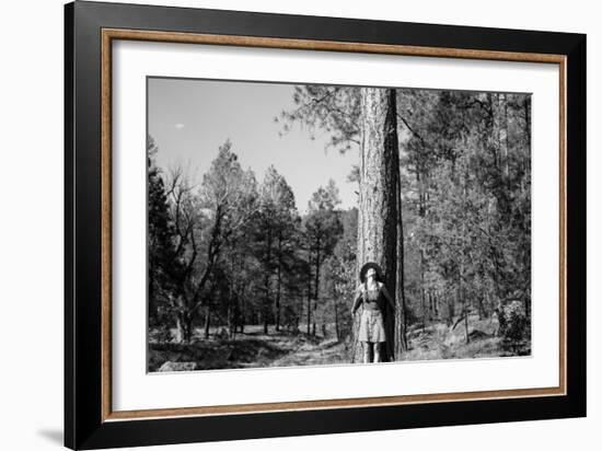 Woman Stands With Her Arms Wrapped Around A Ponderosa Pine Tree Looking Up And Smiling-Hannah Dewey-Framed Photographic Print