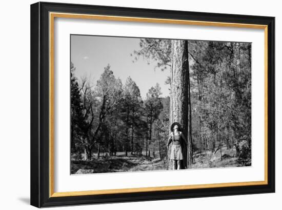 Woman Stands With Her Arms Wrapped Around A Ponderosa Pine Tree Looking Up And Smiling-Hannah Dewey-Framed Photographic Print