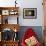 Woman Stands Working In Her Artists Studio In Bozeman, Montana-Hannah Dewey-Framed Photographic Print displayed on a wall