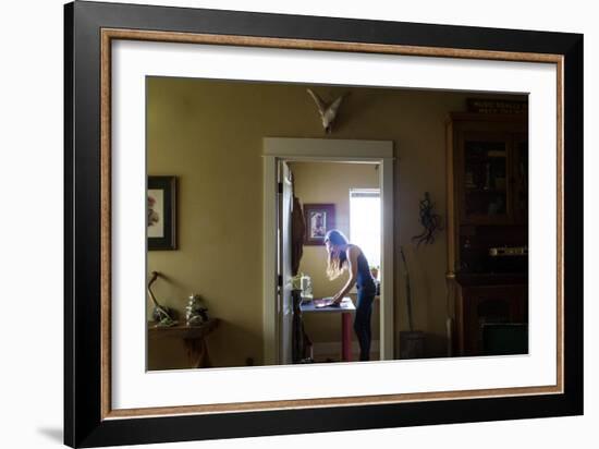 Woman Stands Working In Her Artists Studio In Bozeman, Montana-Hannah Dewey-Framed Photographic Print