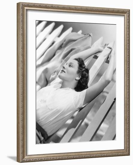 Woman Stretching Out on a Picket Fence-null-Framed Photo