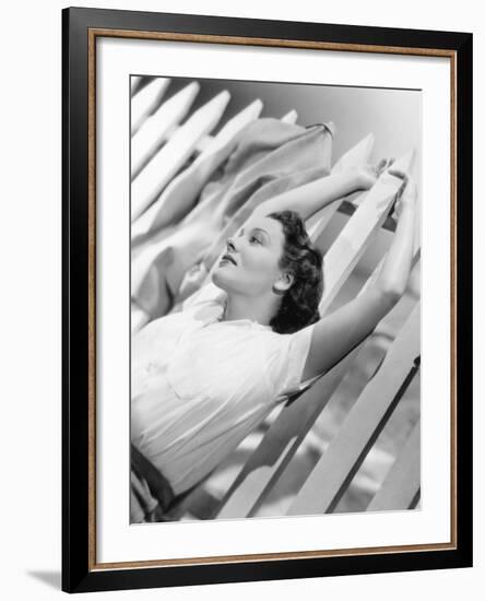 Woman Stretching Out on a Picket Fence-null-Framed Photo