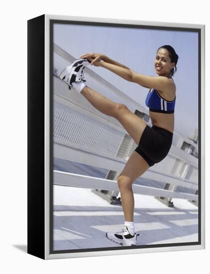 Woman Stretching Outdoors, New York, New York, USA-Chris Trotman-Framed Premier Image Canvas