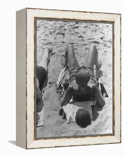 Woman Sunbathing on the French Riviera-John Phillips-Framed Premier Image Canvas