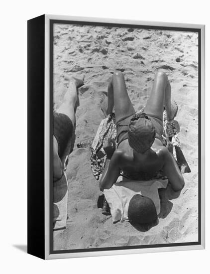 Woman Sunbathing on the French Riviera-John Phillips-Framed Premier Image Canvas