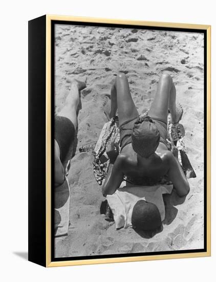 Woman Sunbathing on the French Riviera-John Phillips-Framed Premier Image Canvas