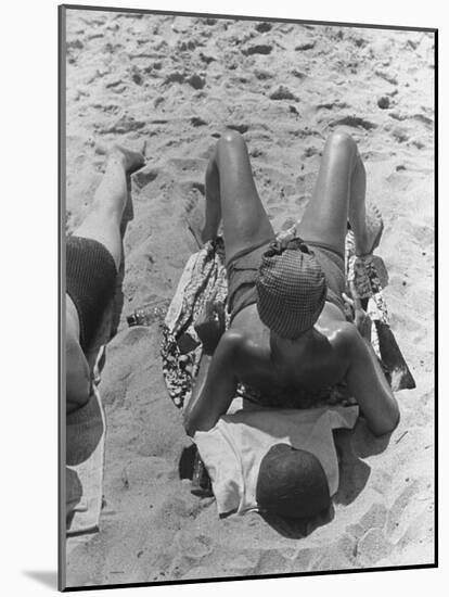 Woman Sunbathing on the French Riviera-John Phillips-Mounted Photographic Print