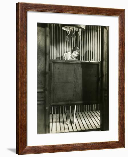 Woman Takes a Shower in a Bathing Cap-null-Framed Photo