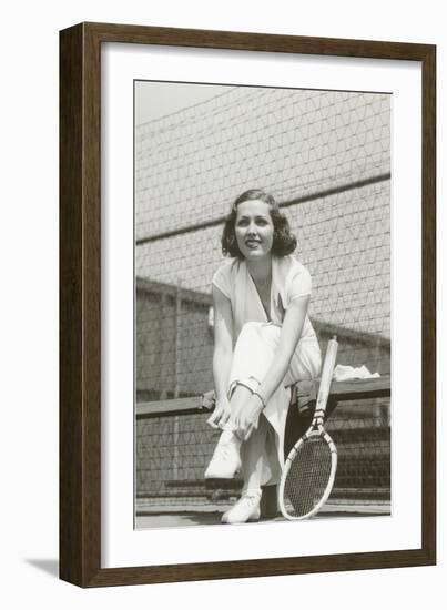 Woman Tennis Player Adjusting Stocking-null-Framed Art Print