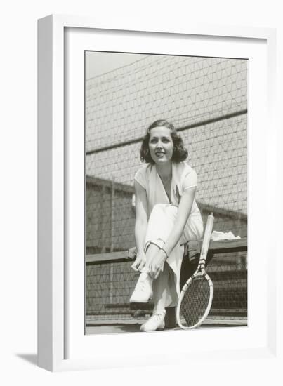 Woman Tennis Player Adjusting Stocking-null-Framed Art Print