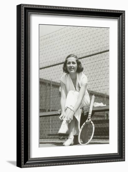 Woman Tennis Player Adjusting Stocking-null-Framed Art Print