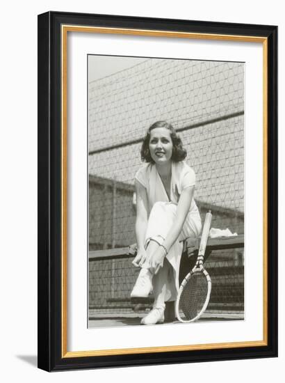 Woman Tennis Player Adjusting Stocking-null-Framed Art Print