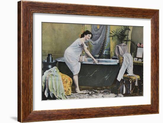 Woman Testing Water Temperature in Bathtub-null-Framed Giclee Print