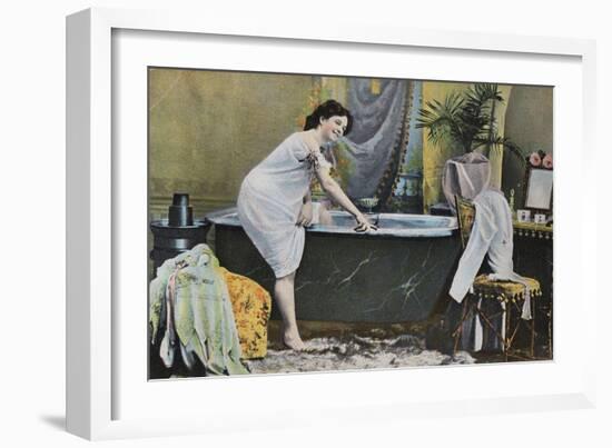 Woman Testing Water Temperature in Bathtub-null-Framed Giclee Print