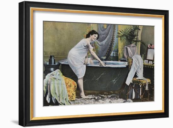 Woman Testing Water Temperature in Bathtub-null-Framed Giclee Print