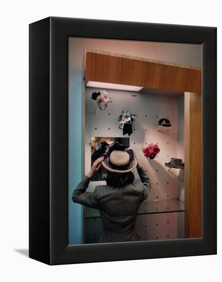 Woman Trying on Hats-Alfred Eisenstaedt-Framed Premier Image Canvas