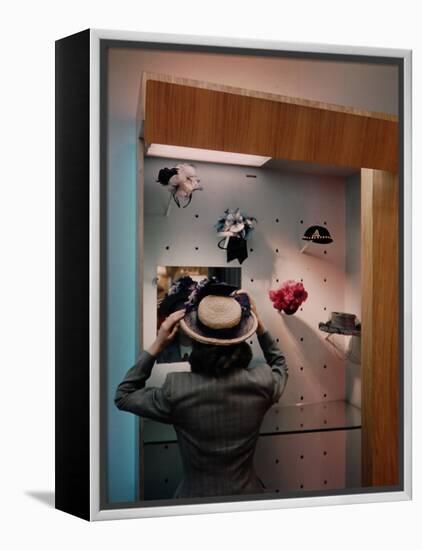 Woman Trying on Hats-Alfred Eisenstaedt-Framed Premier Image Canvas