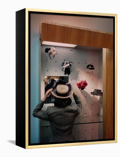 Woman Trying on Hats-Alfred Eisenstaedt-Framed Premier Image Canvas