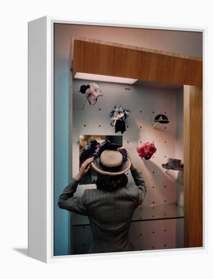 Woman Trying on Hats-Alfred Eisenstaedt-Framed Premier Image Canvas