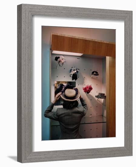 Woman Trying on Hats-Alfred Eisenstaedt-Framed Photographic Print