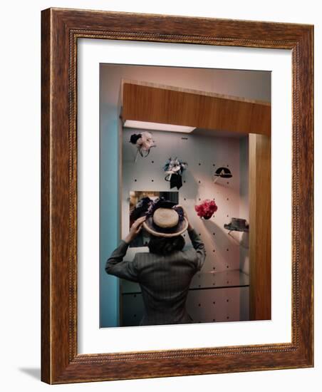 Woman Trying on Hats-Alfred Eisenstaedt-Framed Photographic Print