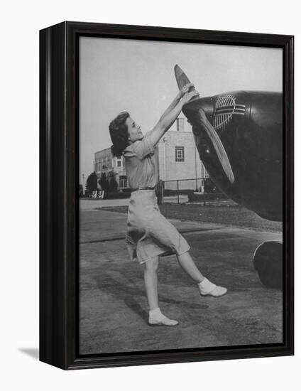 Woman Turning Propeller to Start Plane-David Scherman-Framed Premier Image Canvas