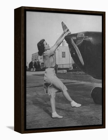 Woman Turning Propeller to Start Plane-David Scherman-Framed Premier Image Canvas