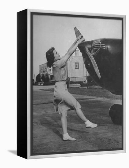 Woman Turning Propeller to Start Plane-David Scherman-Framed Premier Image Canvas