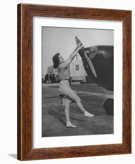 Woman Turning Propeller to Start Plane-David Scherman-Framed Photographic Print