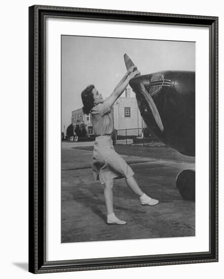 Woman Turning Propeller to Start Plane-David Scherman-Framed Photographic Print