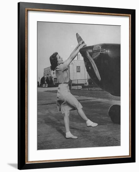 Woman Turning Propeller to Start Plane-David Scherman-Framed Photographic Print