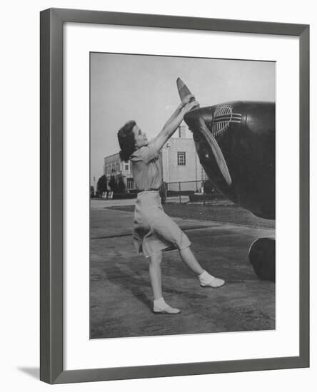 Woman Turning Propeller to Start Plane-David Scherman-Framed Photographic Print