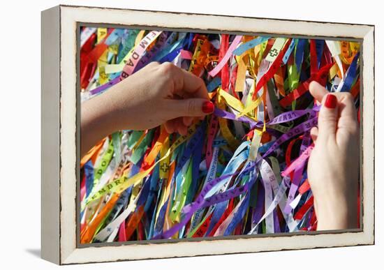 Woman Tying Lucky Ribbon at Igreja Nosso Senhor do Bonfim Church, Salvador, Bahia, Brazil-Yadid Levy-Framed Premier Image Canvas