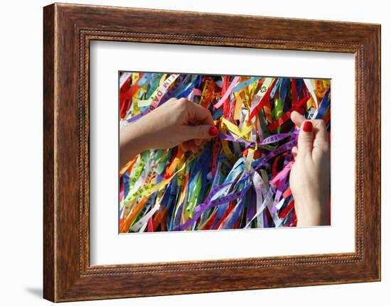 Woman Tying Lucky Ribbon at Igreja Nosso Senhor do Bonfim Church, Salvador, Bahia, Brazil-Yadid Levy-Framed Photographic Print