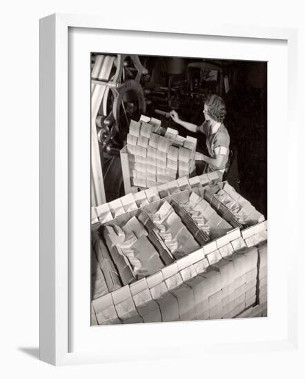 Woman Typing Up Bundles of Paper Bags as They are by Machine Inthe Union Bag and Paper Co. Factory-Margaret Bourke-White-Framed Photographic Print