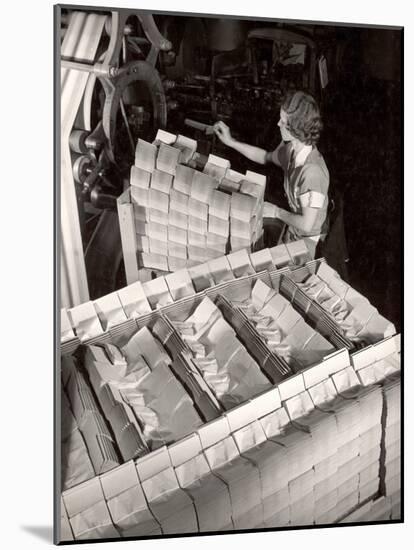 Woman Typing Up Bundles of Paper Bags as They are by Machine Inthe Union Bag and Paper Co. Factory-Margaret Bourke-White-Mounted Photographic Print