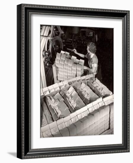 Woman Typing Up Bundles of Paper Bags as They are by Machine Inthe Union Bag and Paper Co. Factory-Margaret Bourke-White-Framed Photographic Print