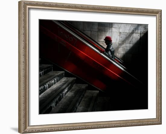 Woman Uses an Escalator at a Pedestrian Underpass in Belgrade, Serbia-null-Framed Photographic Print