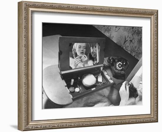 Woman Using a Swing Table to Put on Her Make-Up-Bernard Hoffman-Framed Photographic Print