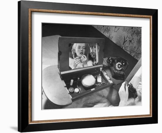 Woman Using a Swing Table to Put on Her Make-Up-Bernard Hoffman-Framed Photographic Print