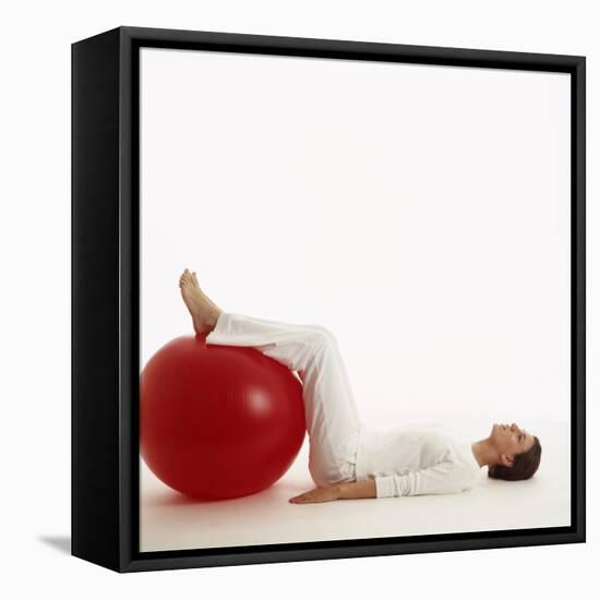 Woman Using An Exercise Ball-Cristina-Framed Premier Image Canvas