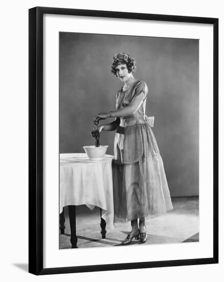 Woman Using Eggbeater-null-Framed Photo