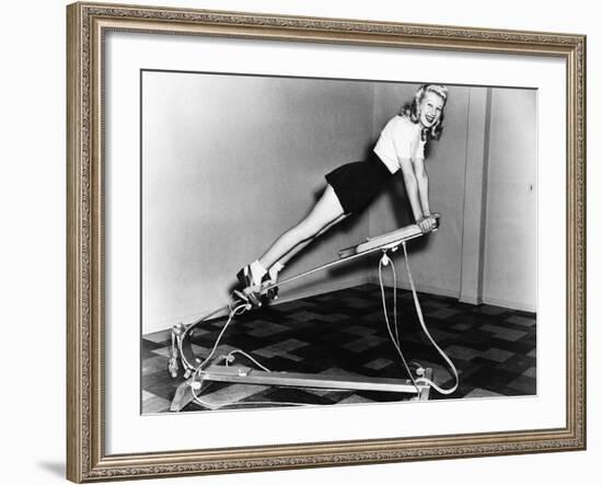 Woman Using Exercise Equipment-null-Framed Photo