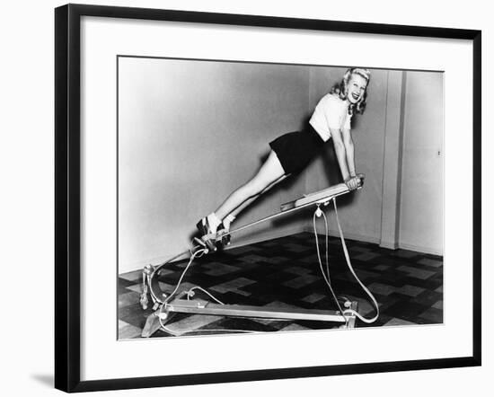 Woman Using Exercise Equipment-null-Framed Photo