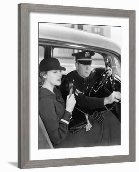 Woman Using Radio in Car with Policeman-null-Framed Photo